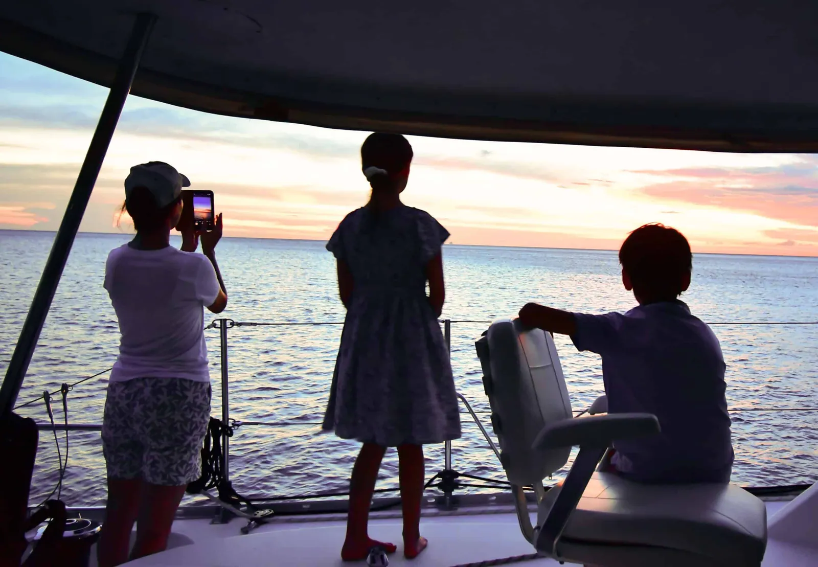 Adventure owners Antares listing photo showing family sunset scaled.