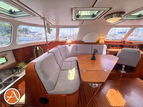 Adventure Antares listing photo showing salon port side.