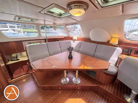 Adventure Antares listing photo showing salong table wings down.
