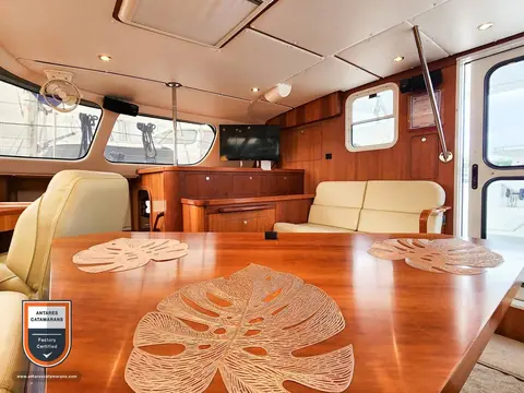 Cinnamon Antares listing photo showing salon table aft.