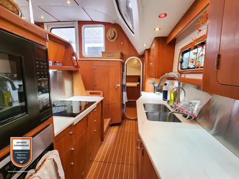 Cloud Nine Antares listing photo showing galley looking aft.