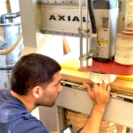 Antares craftsmen reviewing a build detail on the shop floor
