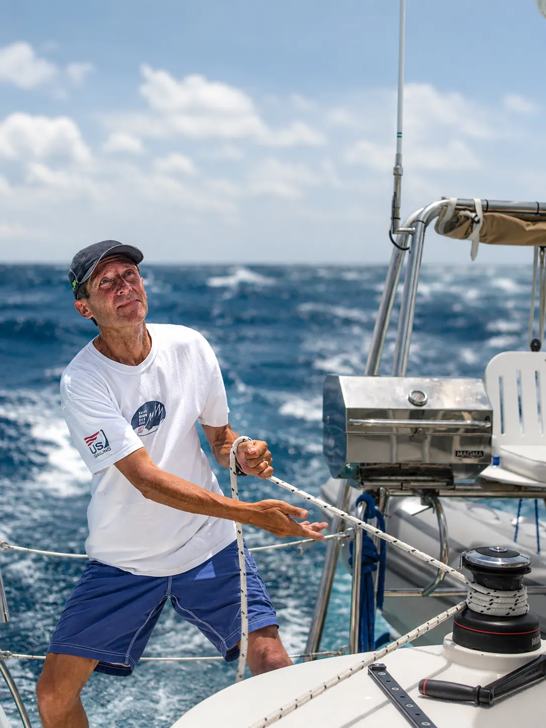 Owner practicing bluewater seamanship line handling at the stern rail