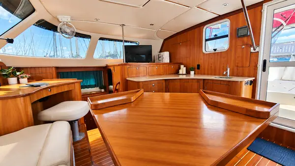 Leap of Faith Antares listing photo showing salon table.