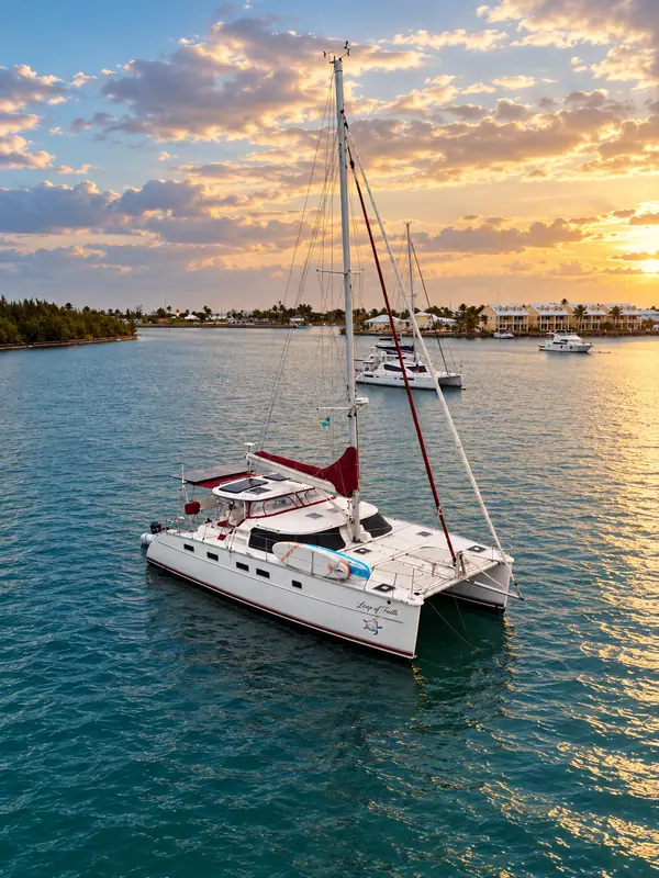 Leap of Faith Antares listing photo showing at anchor sunset.