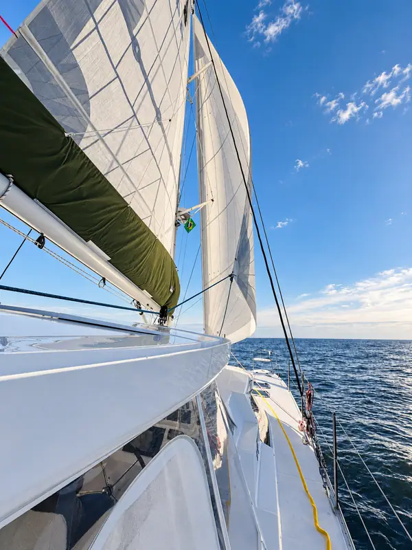 Lucy Antares listing photo showing full sails.