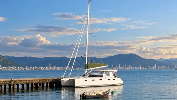 Lucy, a 2025 Antares 44 Hybrid, moored beside a waterfront pier