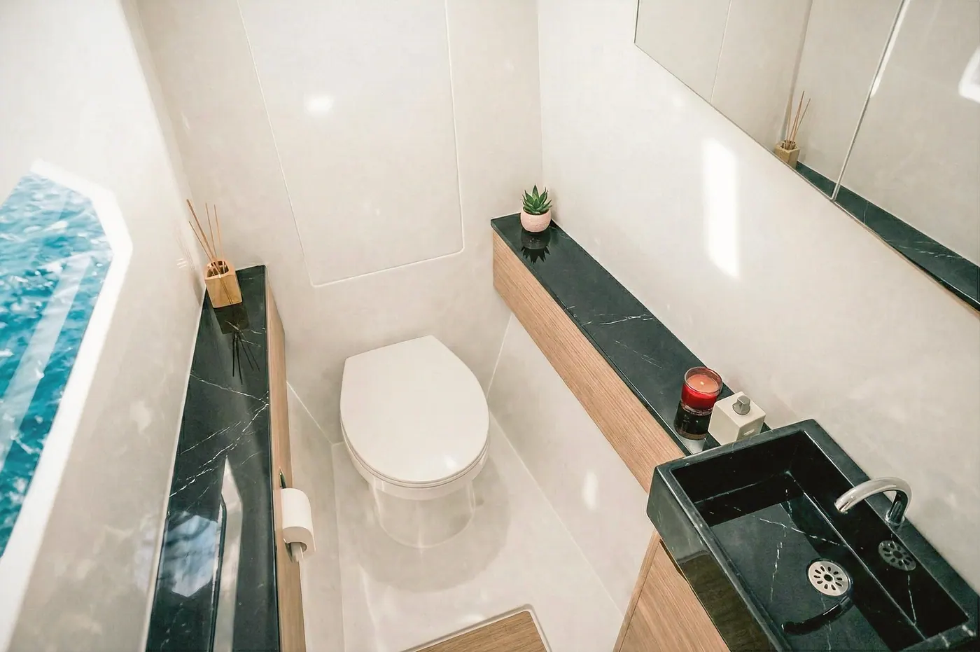 Antares 46 port forward head with toilet, sink and ocean-view window