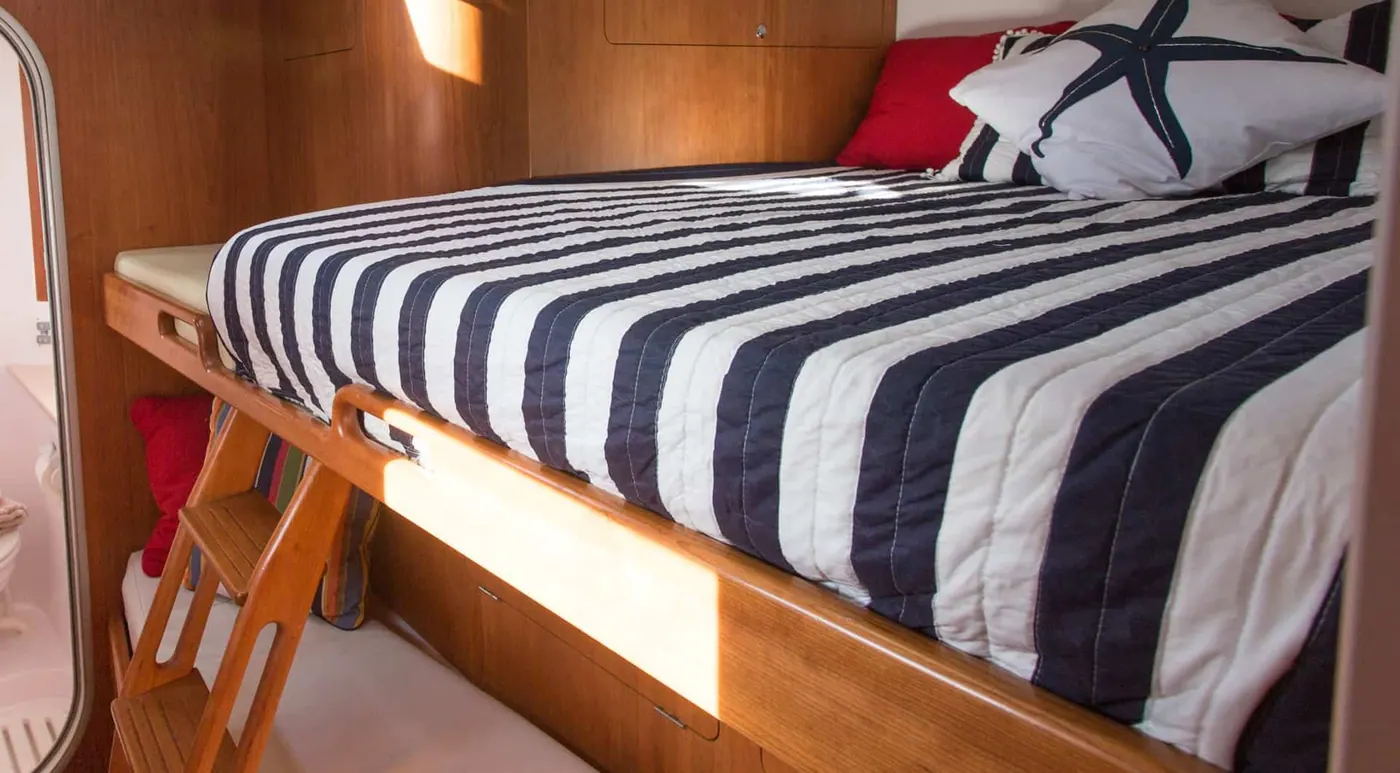 Antares 44 GS aft cabin bunks with striped berth cushions