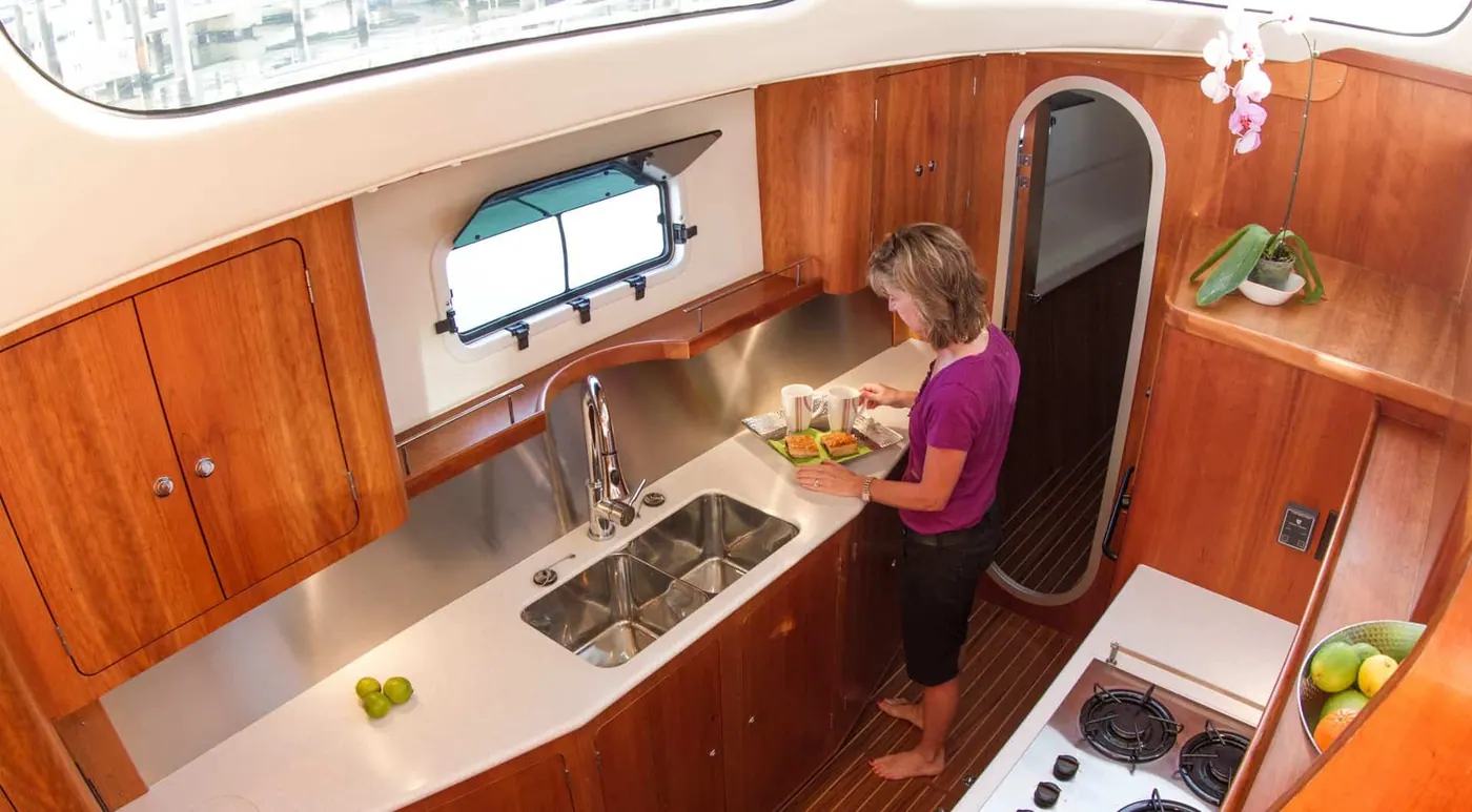 Antares 44 GS galley with owner preparing food in the liveaboard kitchen