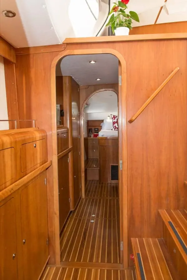 Antares 44 GS master wardrobe and hallway with cherry cabinetry