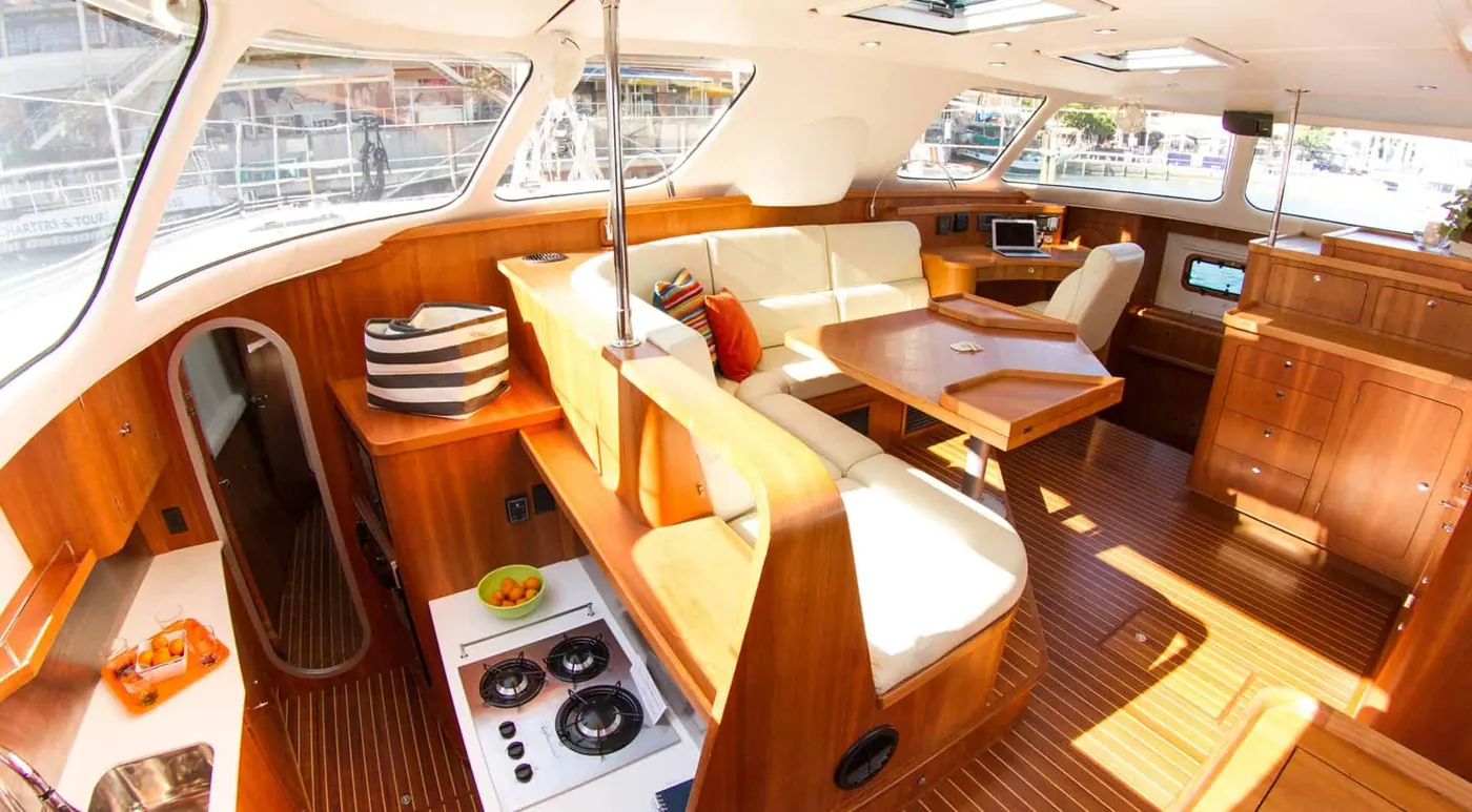 Antares 44 GS warm cherry interior overview with galley and saloon seating