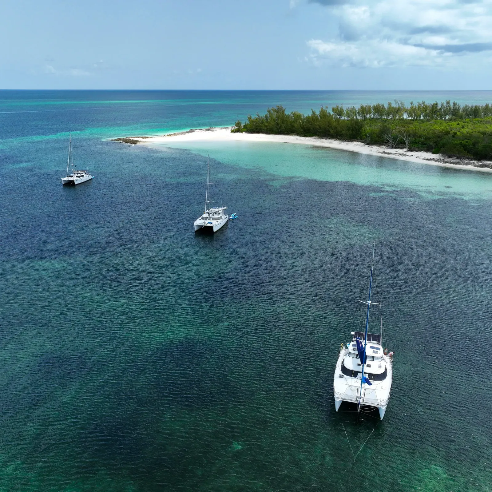 Antares catamaran anchored in clear Bahamas water for technical video library