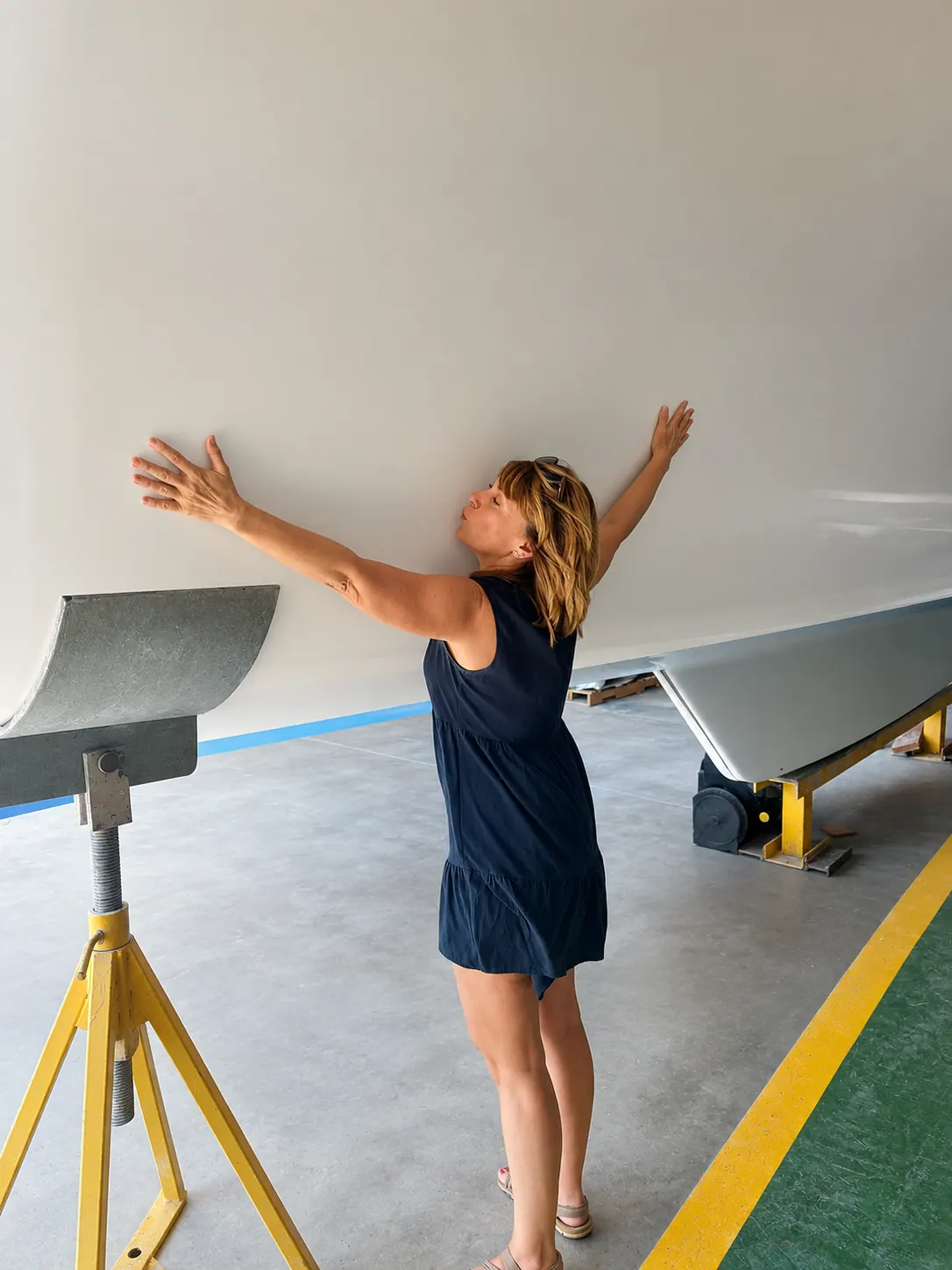 Antares hull inspection with builder checking underside structure before launch