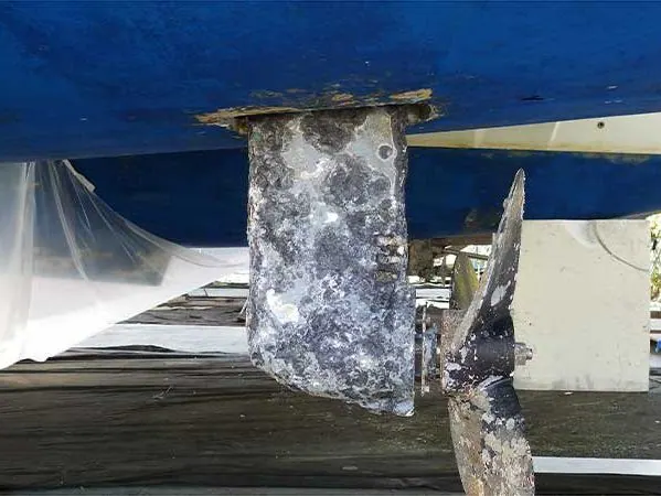 Corroded saildrive leg and propeller area showing exposed underwater hardware