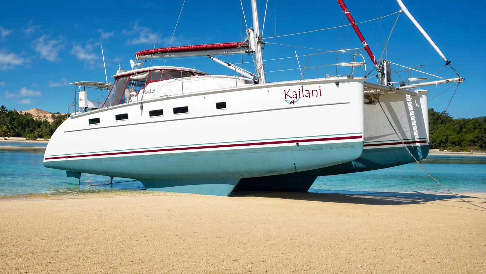 Kailani Antares catamaran beached at low tide showing protected underwater gear